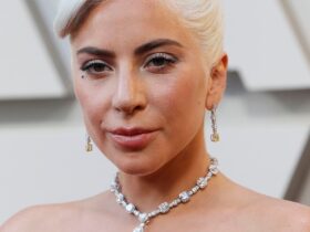 What is Lady Gaga's real name? Lady Gaga's real name is Stefani Joanne Angelina Germanotta.[3] How did Lady Gaga get her stage name? Lady Gaga derived her stage name from the Queen song "Radio Ga Ga".[5] What are some of Lady Gaga's nicknames? Lady Gaga is known by various nicknames including Gagaloo and Loopy.[5] What is Lady Gaga known for? Lady Gaga is renowned as an American singer-songwriter and performance artist, known for her flamboyant costumes, provocative lyrics, and strong vocal talents.[6] Where can I find Lady Gaga's official merchandise? Lady Gaga Net Worth, Nude, Taylor Swift, Lady Gaga, Harley Quinn, Oscars 2023 & More Details